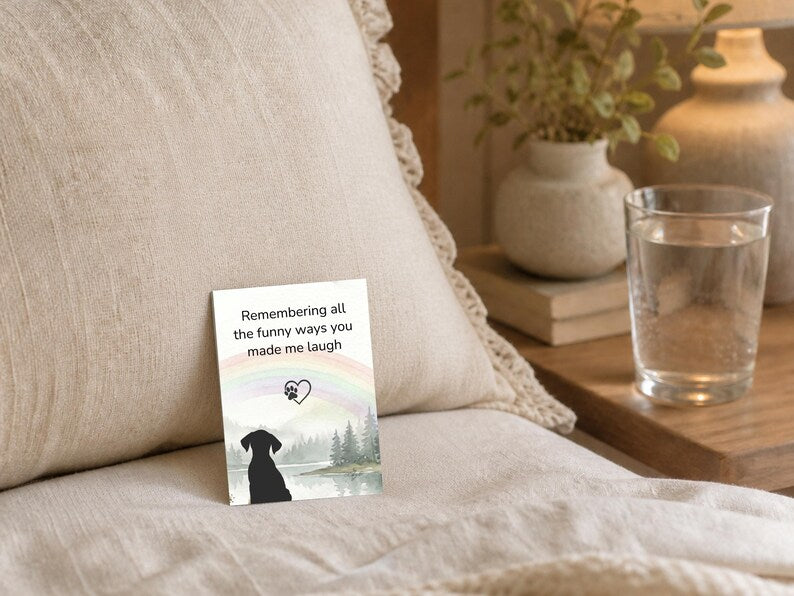 White card reading remembering all the funny ways you made me laugh with a rainbow and dog silhouette