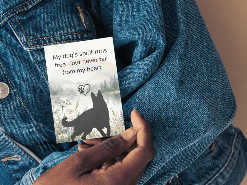 Card reading my dogs spirit runs free but never far from my heart held against a denim jacket