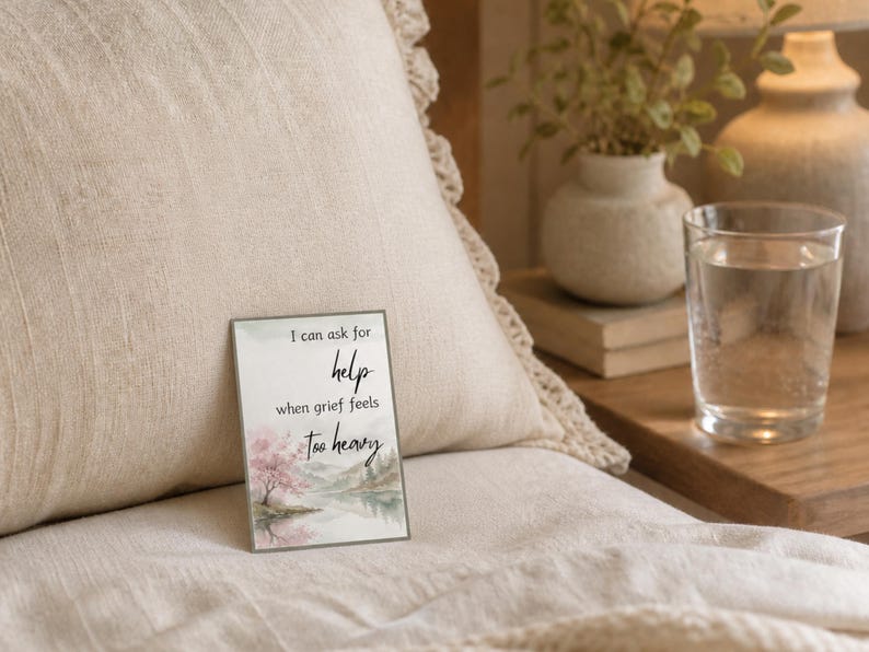 Card reading I can ask for help when grief feels too heavy with a pink tree watercolor on a beige pillow