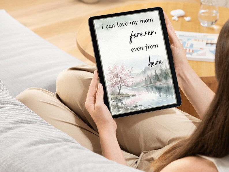 Tablet showing a watercolor landscape and the words I can love my mom forever even from here