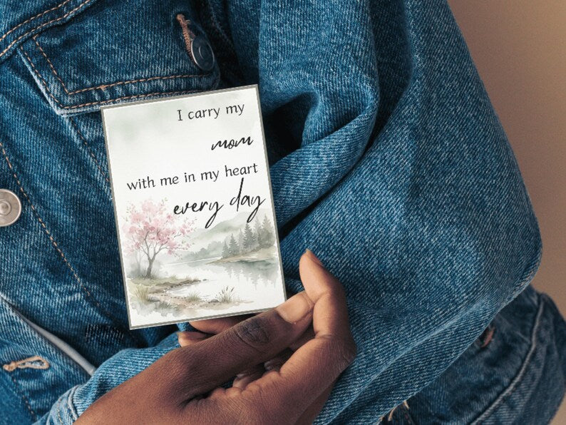 Card reading I carry my mom with me in my heart every day held against a denim jacket