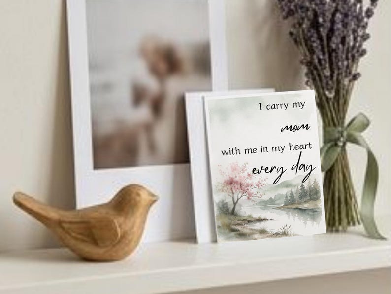 Wooden bird figurine on a shelf beside a framed photo and a card I carry my mom with me with dried lavender