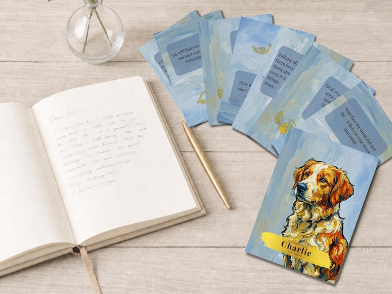 Cards fanned beside an open journal and pen with custom Golden Retriever portrait cover card