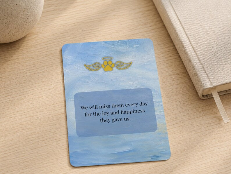 Close up of a single card with the verse we will miss them every day and gold angel wing paw design